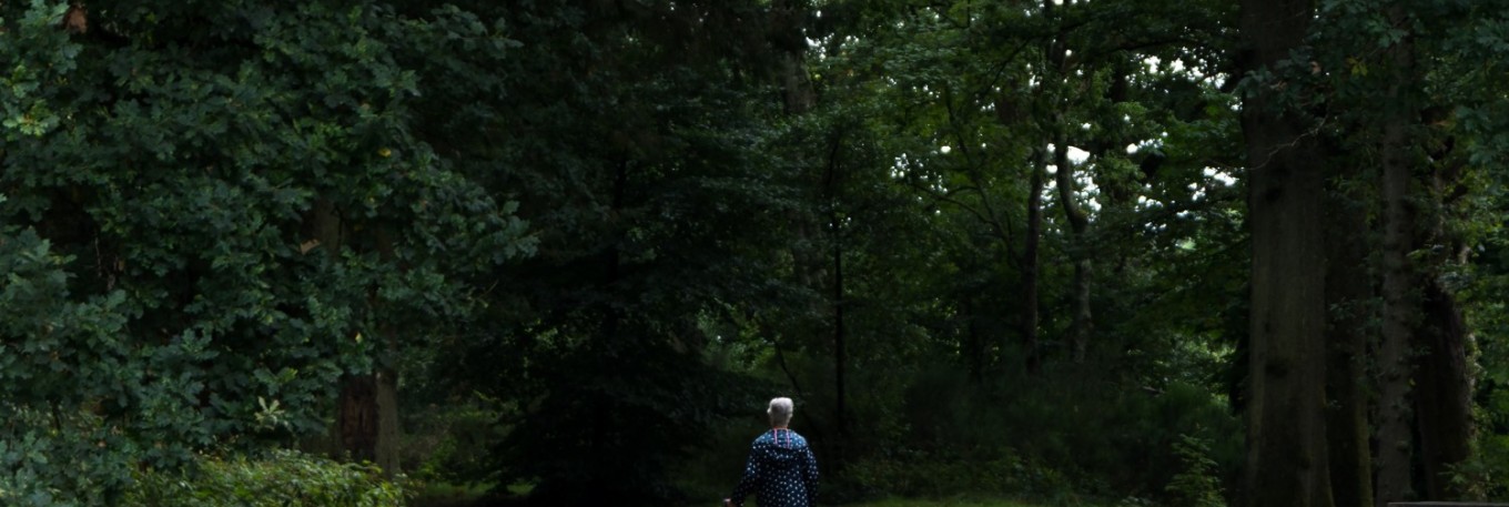 Woman Walking in Woods