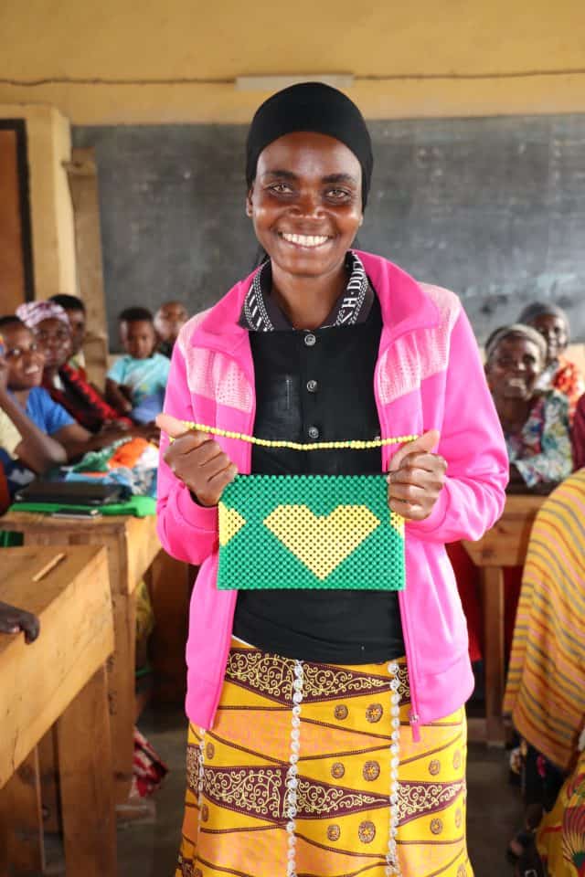 Young woman holding crafted bag